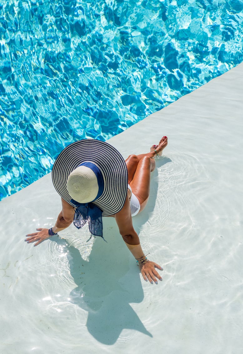 Woman in Luxury Spa Resort Pool